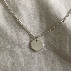 silver circle charm on chain